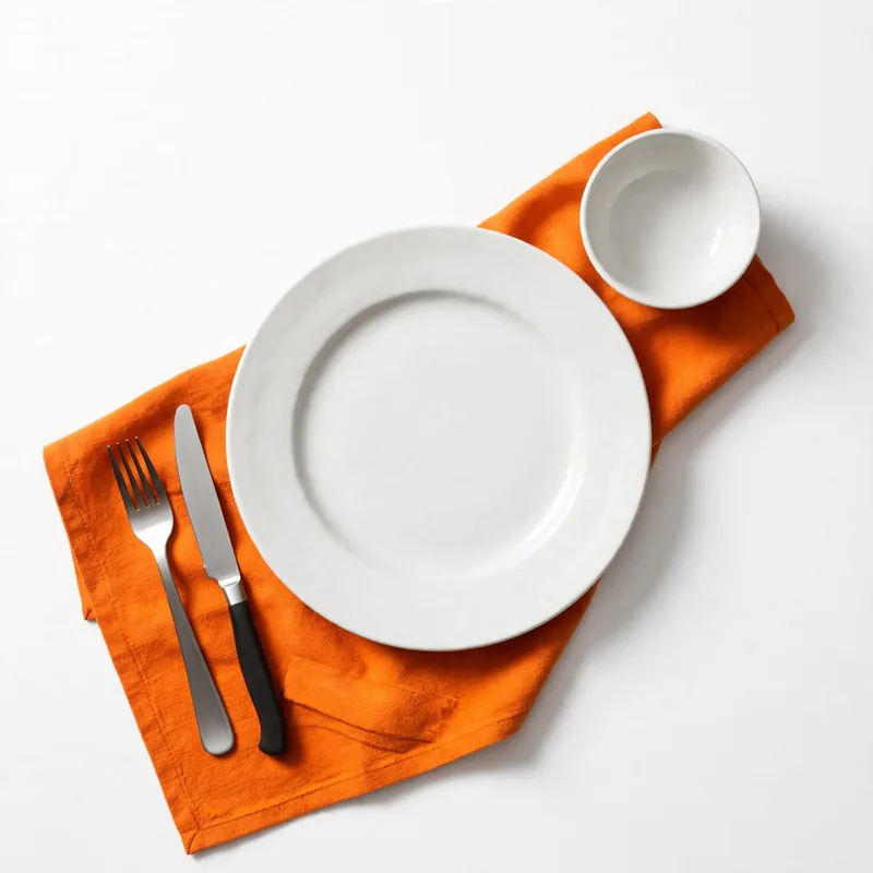 A wide plate with a side bowl